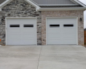 Two residential garage doors with windows